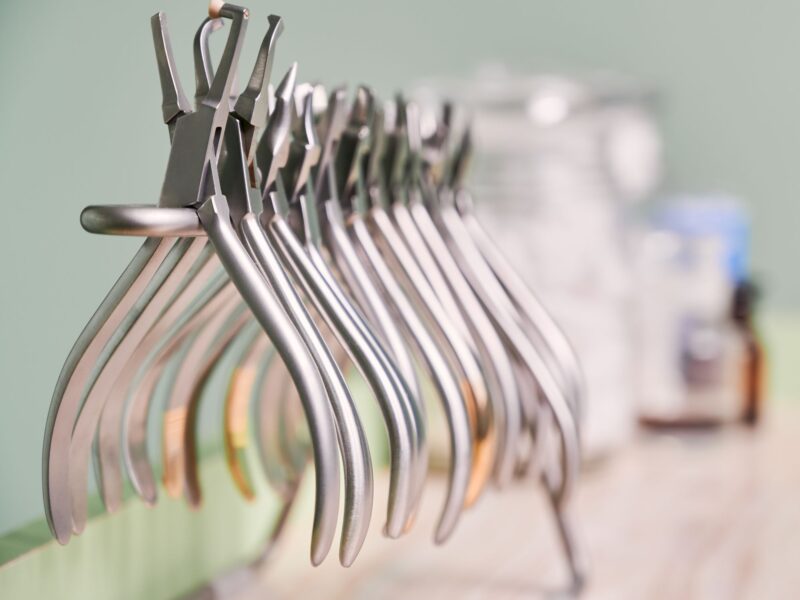 Collection of orthodontic instruments for dental procedure.