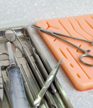 Suturing human skin medical silicone pad and surgical instruments for practice