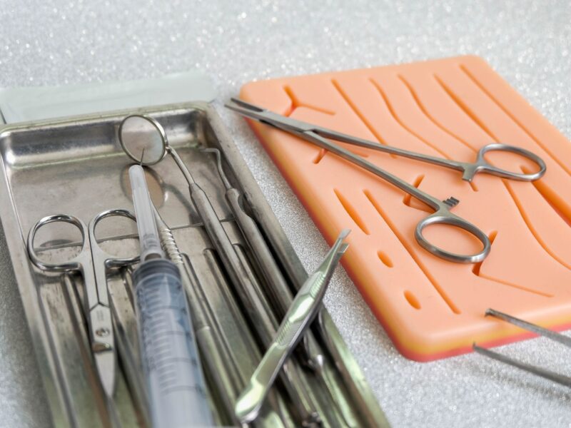 Suturing human skin medical silicone pad and surgical instruments for practice